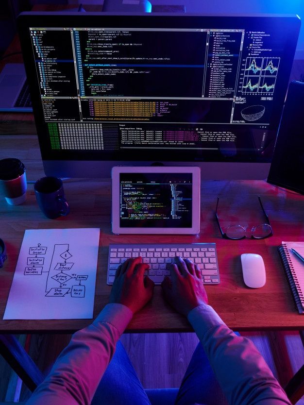 Top view of unrecognizable hacker performing cyberattack at night | Free Photo